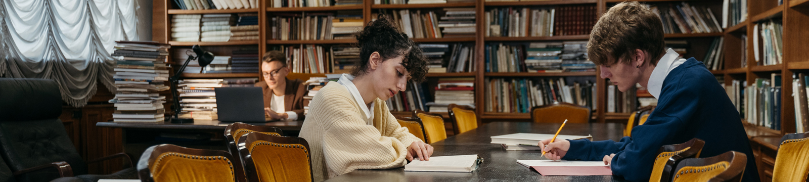 photo showing students studying in a library